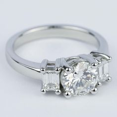 three stone engagement ring setting with baguetts on the sides and side stones in white gold