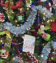 the christmas tree is decorated with many different ornaments