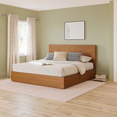 a large bed sitting on top of a hard wood floor next to a wooden dresser