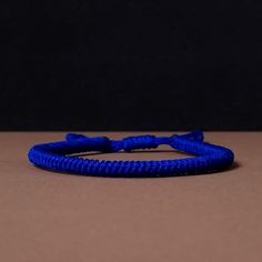 "◾ The handmade navy blue Tibetan bracelet for luck and protection is a beautifully crafted accessory, each knot is meticulously tied whos creates an amazing pattern. ✅ Adjustable bracelet - the slip knot lets you adjust the size. ➰ Sizes: S - Fully Closed - 5.9\"inches (15cm) / Full Opened - 9.8\"inches (25cm) M - Fully Closed - 6.6\"inches (17cm) / Full Opened - 10.6\"inches (27cm) L - Fully Closed - 7.4\"inches (19cm) / Full Opened - 11.4\"inches (29cm) 🟦 The color of the bracelet is navy blue. ◽ More colors and models are available in the shop. ◽ Just check out the shop. ✔️ Please note that due to the difference between different monitors, the image may not reflect the actual color of the item. ✍ If you have any questions please contact me." Blue Casual Nylon Cord Friendship Bracelets, Casual Blue Nylon Cord Friendship Bracelets, Resizable Nylon Cord Braided Bracelets, Blue Nylon Cord Bracelets With Adjustable Length, Blue Woven Bracelets As A Gift, Blue Woven Bracelets As Gifts, Blue Adjustable Nylon Cord Bracelets, Blue Woven Bracelet Perfect For Gift, Blue Woven Bracelet Perfect For Gifting