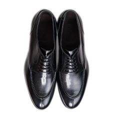 Ready to conquer the day? We’ve taken our timeless split toe derby silhouette and made it deep, dark, and black. This is a traditional, rich and refined shoe has an edge over the classic cap toe oxfords. We’ve also made this dress shoe with a Dainite sole so you can wear them all year round. Whether it's a formal events, or a night out with friends this is the perfect allrounder. Upper: Full-grain Italian leather Sole: Dainite lugged sole, British made* Construction: 360° Storm Goodyear welt (Re Timeless Fitted Plain Toe Oxfords, Timeless Plain Toe Lace-up Shoes For Business Casual, Timeless Oxford Shoes For Business, Timeless Cap Toe Dress Shoes For Derby, Semi-formal Plain Toe Derby Shoes, Timeless Fitted Goodyear Welted Oxfords, Goodyear Welted Almond Toe Dress Shoes For Derby, Timeless Goodyear Welted Oxfords For Derby, Timeless Almond Toe Oxfords For Business Casual