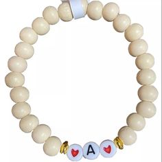 Wooden Beaded Bracelet Initial A. Stretchy. Stackable New With Tags Everyday White Beaded Bracelets With Heart Beads, Trendy White 8mm Beads, Adjustable White Name Bracelet With Heart Beads, Cream Round Bead Bracelets For Everyday, Beige Beaded Stretch Bracelet Gift, Beige Beaded Stretch Bracelet For Gift, Beige Beaded Stretch Bracelet As Gift, Everyday White Beaded Stretch Bracelet, White Wooden Beads Stretch Bracelet Gift