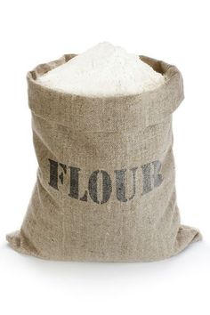 flour in a burlock bag on a white background