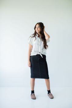 With the look of real denim but the feel of a quality knit, comfort is the key element in our exclusively designed 'Piper 'Skirt. The quick, pull on style with a fabric covered waistband makes this skirt a practical everyday option! Soft, comfortable knit denim fabric Functional Back Pockets 70% Rayon 25% Polyester 5% Spandex Wash Cold Gentle Cycle Hang to Dry Fabric covered elastic waistband Model A Height in Dark Blue 5'5" | Wearing Size Small Wearing 'Finch' Smocked Yoke Cotton Gingham Top in Gingham Top, Knit Denim, Gingham Tops, Dinner With Friends, Knit Skirt, Main Street, Denim Fabric, Fabric Covered, Soft Knits