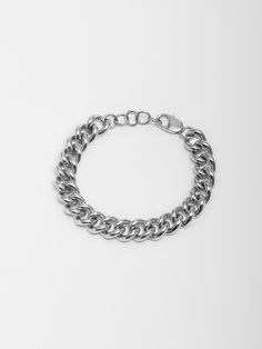 Sterling Silver Solid XL Industrial Curb Chain Bracelet Width: 9.5mm Thickness: 2.5mm Lobster Clasp Adjustable: 1" Extension Total Length: 8" Made in L.A. Globally Sourced Materials Modern Chunky Chain Cuban Link Bracelets, Modern Bracelets With Chunky Cuban Link Chain, Silver Chunky Chain Bracelet For Formal Occasions, Classic White Gold Bracelet With Chunky Chain, Elegant White Gold Bracelet With Chunky Chain, Classic Chunky Link Chain Bracelet, Classic Cuban Link Bracelet With Chunky Chain, Classic Chunky Cuban Link Chain Bracelet, Classic White Gold Bracelets With Chunky Chain