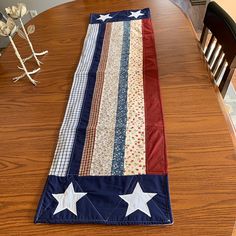 an american flag table runner sitting on top of a wooden table