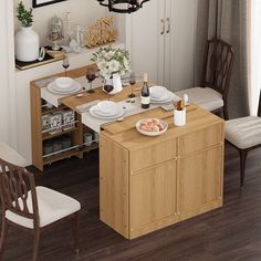 a dining room table with plates and glasses on it