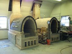 a large brick oven sitting inside of a building