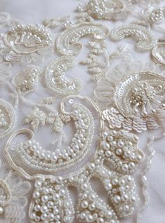 Hand-made wedding trim beaded richly with pearls ribbons and | Etsy Elegant Embellished Embroidered Fabric For Mother Of The Bride, Elegant Embellished Fabric For Mother Of The Bride, Elegant Embroidered Fabric With Pearl Embroidery For Reception, Elegant Pearl Embroidered Fabric For Reception, White Embellished Embroidered Fabric For Celebrations, Elegant White Beaded Embroidered Fabric, Elegant White Embroidered Beaded Fabric, Elegant Embellished Lace Bridal Accessories, Elegant Pearl Embroidered Fabric For Celebration