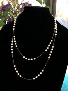 "This piece was designed to copy an actual necklace worn by Lady Mary in the PBS series Downton Abbey. This necklace is 50\" of tiny glittering faceted gold natural iron pyrite beads interspersed with mint condition 6mm vintage cream colored pearls with a fantastic creamy pink luster OR genuine AAA freshwater pearls (choose when you checkout). This is a VERY long necklace; it measures 50\" total from top to bottom. It can be worn as one long necklace (if you're tall or channeling your inner flap Formal Double Strand Long Necklace, Elegant Double Strand Long Necklace For Formal Occasions, Formal Beaded Double Strand Pearl Necklace, Formal Double Strand Beaded Pearl Necklace, Classic Beaded Pearl Necklace For Evening, Long Beaded Pearl Necklace For Formal Occasions, Formal Long Beaded Necklaces With Pearl Chain, Formal Long Beaded Pearl Necklace, Elegant Long Pearl Necklace With Beaded Chain