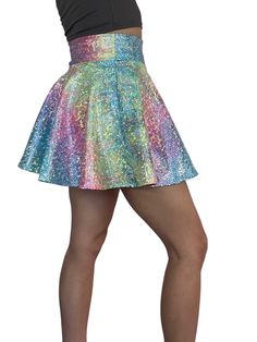 Introducing our stunning Rainbow Ombre Holographic Skater Skirt, inspired by Taylor Swift's iconic Lover outfit and designed for the ultimate music festival and rave experience. Crafted with care in the USA, this skirt combines captivating style with unmatched quality to ensure you make a bold statement on the dance floor.Crafted from high-quality stretchy rainbow avatar spandex, this skirt offers a comfortable and flexible fit that allows you to move freely and dance with ease. The flattering s Fitted Mini Skirt For Concert, Rave Skirt For Spring Party, Spring Rave Party Skirt, Spring Rave Skirt For Party, Spring Party Rave Skirt, Rave Style Skirt For Spring Party, Festival Dance Skirt, Fitted, Disco Style Skirt For Party Season Festival, Festival Fitted Skirt For Dance