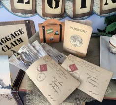 an assortment of luggage and stamps on display in front of the eiffel tower