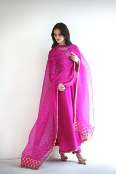 Meticulously crafted from a remarkably glamourous shade of magenta ( pure raw silk 60 gms )“ Zabe “ with its intricate hand crafted details strikes the perfect balance between elegant and eye-catching, making this beautiful design a must have. The length of the kalidaar is 48 inches.Agha Noor’s style tip - “ Dress it u Agha Noor, Pakistani Formal Dresses, Long Kurti Designs, Ethnic Outfits, Stylish Sarees, Stylish Dress Book, Pakistani Dress Design, Fashion Design Clothes, Raw Silk