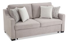 a gray couch with pillows on it