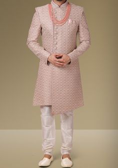 Ready-Made Sherwani With Trouser. Jacquard Brocade Fabric Top. Art Dupion Aligarhi Ready Made Trouser. Crafted in Chinese Collar Neck, and Full Sleeve. Satin Lining with Plain Work. High-Quality Matching Buttons. Please Note: The footwear shown in the picture is for presentation and photography purpose only. Color: There might be slight color variation due to lightings and flashes while photo shooting. The color may also vary because of different screen resolutions. Wash Care: Dry Clean Only. Men Sherwani Designs Style, Traditional Bandhgala With Chikankari Embroidery In Art Silk, Designer Art Silk Sherwani With Chikankari Embroidery, Designer Brocade Bandhgala With Chikankari Embroidery, Raw Silk Bandhgala For Reception At Eid, Eid Bandhgala In Raw Silk For Reception, Transitional Bandhgala With Chikankari Embroidery In Brocade, Eid Reception Bandhgala In Raw Silk, Festival Brocade Bandhgala With Chikankari Embroidery