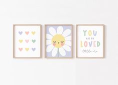 three framed art prints with hearts and flowers on the wall above them are you are so loved little one