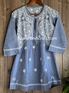 Unique denim look Chikankari hand embroidered a line blouse. Length: 30 inches Traditional Blue Blouse With Chikankari Embroidery, Cotton Embroidered Top With Resham In Straight Kurta Style, Embroidered Cotton Straight Kurta Blouse, Traditional Cotton Blouse With Chikankari Embroidery, Cotton Straight Kurta With Chikankari Embroidery, Festive Cotton Top With Chikankari Embroidery, Cotton Embroidered Top With Resham Embroidery For Festivals, Casual Embroidered Kurta For Festivals, Traditional Straight Kurta Blouse For Spring