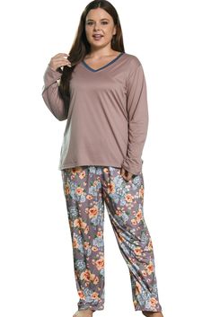 a woman in pajamas is posing for the camera