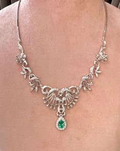 Elegant and exquisite, Victorian style necklace with diamonds in 18Kt white gold in symmetrical floral design, beautifully handcrafted. The center sits a sparkly, enchanting natural Colombian Emerald in pear cut, the emerald is 0.70 ct and has stunning luster, it is surrounded with a halo of natural brilliant white diamonds weight approx 0.2 ct. The necklace is a true beauty, ravishing and gleaming, the floral part was made with 9 hinged section, with millegrain setting details and dainty diamonds, each leafy & floral part was made separately, for better movement and easy to wear. The Chain is solid 18Kt White Gold box chain with strand hook clasps at back. Length : 38 CM Diamond : 0.7 TCW approx Emerald : 0.7 Ct  Total Weight : 23.9 G Necklace Fine Jewelry, Necklace With Diamond, Victorian Necklace, Big Diamond, Colombian Emeralds, Gold Box, Emerald Necklace, Bespoke Jewellery, Style Necklace