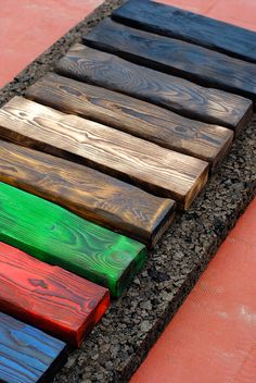 colorful wooden planks lined up on the ground