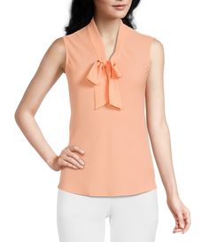 From Kasper, this blouse features:V-neckline with tie front sashSleevelessStraight hemlinePullover constructionPolyesterDry cleanImported. Elegant V-neck Top With Bow, Chic Sleeveless Top With Tie Waist, Spring V-neck Top With Bow Detail, Spring V-neck Top With Bow, V-neck Top With Bow For Spring, Elegant Summer Blouse With Tie Waist, Feminine Sleeveless Top With Bow, Sleeveless Tie Waist Top For Spring, Feminine Sleeveless Bow Top