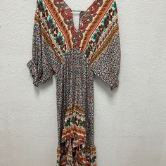 Umgee New With Tags Boho Dress Low Cut Front And Back 3/4 Length Sleeves Orange V-neck Summer Maxi Dress, Orange V-neck Maxi Dress For Vacation, Orange V-neck Maxi Dress For Beach, Orange V-neck Midi Dress For Beach, Long Printed Hippie Dresses, Multicolor Boho Print V-neck Dress, Festival Boho Print Midi Dress With V-neck, V-neck Midi Dress With Boho Print For Festivals, Festival Midi Dress With Boho Print And V-neck