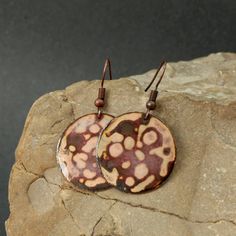 These earrings were created using a kiln firing method. Copper is cut, filed and sanded. Fine glass powder is then layered on the copper and heated the piece with a kiln. These last two steps are repeated many times until the final look is achieved. Each of my products is an original. That's why even the same item can be partly different from the photograph - as for the size, pattern or colour. diameter circle 1 in Artisan Brown Earrings With Patina, Artisan Brown Patina Earrings, Artistic Copper Earrings, Earthy Soldered Earrings For Gift, Artisan Rust-colored Earrings As Gift, Artistic Brown Copper Earrings, Earthy Rust-colored Earrings For Gift, Earthy Rust-colored Earrings As Gift, Enameling Ideas