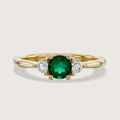 Luxurious and lavish, the Audrey ring is a mesmerizing assembly of a bold center green emerald in-between two regal accent white diamonds. This glamorous piece is perfect for any occasion, especially an engagement, and adds the flawless amount of sparkle to any look. A timeless piece that can be customized with any stones your heart desires. All features can be customized! Please contact us if you wish to make changes, we love making custom designs. All of our jewelry is carefully handmade in our atelier. *HC diamond are all conflict-free diamonds To order by phone 972-72-2991000 See In White Gold Timeless Green Rings With Accent Stones, Green 14k Gold Diamond Promise Ring, Timeless Green Diamond Promise Ring, Green Diamond Promise Ring In 14k Gold, Emerald Ring With Vvs Clarity For May Birthstone Promise, Green Diamond Birthstone Ring With Brilliant Cut, Green Diamond Birthstone Ring For Promise, Green Emerald Ring With Diamond Accents For Promise, Green Emerald Ring With Brilliant Cut For Promise