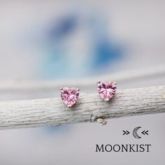 Great for everyday wear, these Pink Tourmaline CZ heart earrings feature 6 mm heart shaped faceted gemstones, hand set in sterling silver 3 prong stud earring mountings. These mountings are firmly soldered and tumble polished for hours to increase durability. The posts on these earrings are 11 mm (.45 inches) long, and sterling silver clutch backs are included with your purchase. CZ (cubic zirconia) is a laboratory grown gemstone that has a hardness similar to topaz and quartz. It is available i Sterling Silver Heart Earrings With Gemstone For Valentine's Day, Sterling Silver Heart Earrings With Gemstones, Pink Heart-shaped Gemstone Earrings, Gemstone Heart Earrings For Anniversary, Pink Heart Gemstone Earrings, Sterling Silver Heart Earrings With Birthstone, Sterling Silver Heart Cut Birthstone Earrings, Valentine's Day Heart Cut Birthstone Earrings, Heart-shaped Gemstone Earrings As Gift