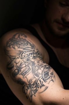 a man with a tattoo on his arm