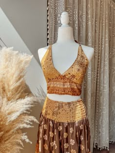 Choose bralette only, skirt only, or the two piece set~  BRALETTE DETAILS Gorgeous halter tie-back silk bralette in our stunning Desert Solstice© print! Perfect for a summer top, or fall layering.  S/M recommended for busts 30-34" L/XL recommended for busts 36-40" 2/3X recommended for busts 42-46"  SKIRT DETAILS Made from a beautiful lightweight silk blend fabric in our exclusive Desert Solstice© print. This airy, feminine skirt features multiple tiers for a flattering, flowy look + twirls that Simple Coachella Outfit, Boho Bra, Silk Bralette, Boho Whimsical, Feminine Skirt, Moon Dress, Festival Skirts, Skirt Details, Fall Layering