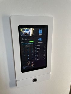 an appliance mounted to the side of a refrigerator door with buttons on it