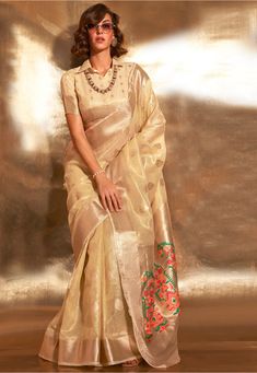 Art Silk Saree in Cream This drape is Enhanced with Resham, Zari Woven in Ornamental and Abstract Motifs Available with an Unstitched Art Silk Blouse in Cream Do note: 1.)Accessories shown in image is for presentation purpose only. 2.)Slight variation in actual color vs. image is possible. 3.)Irregularities in weaving and contrast color is natural due to hand-done dying process Tissue Fabric, Tissue Saree, Indian Wedding Wear, Utsav Fashion, Art Silk Sarees, Blouse Material, Soft Silk Sarees, Traditional Sarees, Party Wear Sarees