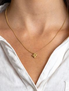 This Roberto Coin Princess Flower Pendant Necklace is crafted from 18k yellow gold and features four petals with smooth surfaces and intricately twisted edges that come together to create a stunning flower. This simple necklace will add a feminine and romantic touch to any look, featuring the Roberto Coin signature hidden ruby as a gift of good wishes to the wearer. Details •18k yellow gold •Small pendant Style# 7771367AYCH0 Yellow Gold Flower Pendant Necklace With Diamond Cut, Gold Plated Flower Pendant Necklace, Delicate Yellow Gold Flower Necklace, Gold Flower Pendant Necklace In Fine Jewelry Style, Yellow Gold Plated Flower Shaped Necklace, Yellow Gold Plated Flower Necklace, Yellow Gold Necklace With Flower Pendant, Gold Plated Yellow Gold Flower Necklace, Delicate Yellow Gold Flower Necklace With Delicate Chain