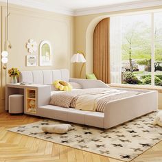 a bed room with a neatly made bed next to a window and a rug on the floor