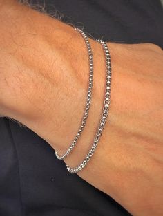 Elevate your style with our men's silver-tone stainless steel chain bracelet. Crafted from durable stainless steel, this bracelet is resistant to corrosion and tarnish, ensuring long-lasting shine and reliability. Features: - Material: Stainless Steel - Color: Silver-Tone - Sizes: Available in various lengths for a perfect fit This bracelet is perfect for both everyday wear and special occasions, easily pairing with other accessories and jewelry. The secure clasp ensures comfort and safety. Add Tarnish Resistant White Gold Stainless Steel Bracelets, Tarnish Resistant Stainless Steel Chain Link Bracelets, Stainless Steel Tarnish Resistant Chain Link Bracelets, Silver Tarnish-resistant Cuban Link Bracelet, Adjustable Stainless Steel Silver Chain Bracelet, Silver Tarnish Resistant Tennis Bracelet Gift, Stainless Steel Cuban Link Bracelet With Box Chain, Silver Stainless Steel Tarnish Resistant Chain Bracelet, Silver Stainless Steel Tarnish-resistant Chain Bracelet