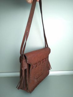 Vintage genuine leather bag - Retro leather bag - Old leather bag from 70' - brown leather bag - Old Genuine Leather Bag - Shoulder bag Beautiful shoulder bag made of genuine leather . For people who love items with history . Dimensions : Height without the handle - 25 cm x 23 cm x 6,5 cm For other GENUINE LEATHER BAG please check here : https://www.etsy.com/shop/TheVINTAGEShopBG?ref=l2-shopheader-name&section_id=22456024 All pictures are real . You buy exactly what you see in the photos . T Brown Soft Leather Rectangular Flap Bag, Tan Leather-lined Shoulder Bag, Tan Leather Flap Bag For Travel, Tan Leather Satchel Bag, Tan Leather Flap Bag For Everyday, Everyday Tan Leather Flap Bag, Brown Leather Shoulder Bag With Textured Leather, Brown Leather Shoulder Bag With Textured Finish, Brown Leather Shoulder Bag With Textured Detail