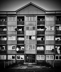 black and white photograph of an apartment building