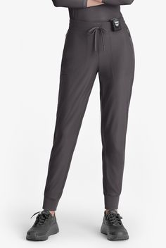 Kick your comfort up a notch with Skechers Slip-ins by Barco. This knit fabric is silky soft, stretchy, and as comfy as they come. So, slide out of those ordinary scrubs, and slip into comfort - because you deserve total scrub love! These joggers feature a ribbed cuff and an encased elastic waistband with drawcord that will keep you secure all day. • Modern fit • Mid-rise • Flat front elastic waistband with drawstring • Jogger • Total of 5 pockets • 2 front vertical zipper pockets • 1 right carg Stretch Straight Leg Activewear With Pockets, Functional Gray Bottoms With Pockets, Fitted Full Length Joggers With Pockets, Stretch Athleisure Cargo Pants, Comfort Stretch Sweatpants With Pockets, Stretch Athleisure Cargo Pants With Tapered Leg, Utility Sports Bottoms, Sporty Stretch Bottoms With Pockets, Stretch Utility Activewear With Pockets