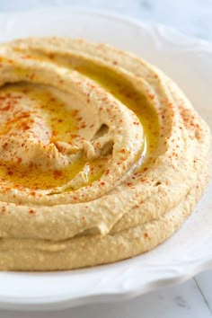 hummus on a white plate with the words updated above it