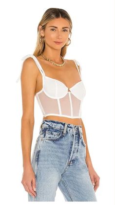 Elevate your style with the Kat the Label Femme Bustier in White. Perfect for creating stunning white bustier top outfits for a night out or pairing with jeans for a casual yet chic look. Whether you're wondering how to style a white bustier top or looking for inspiration for a white denim bustier outfit, this versatile piece is a must-have. Ideal for layering or wearing as a statement on its own. Shop now at Famous Designer Brands 4 Less!

White Denim Bustier Outfit, White Fox Sharp Edges Bustier, How to Style White Bustier, White Bustier Jeans, White Bustier Top Outfits Night, White Bustier Zara, White Corset Bustier Outfit, Bustier White Dress Outfit, How to Style a White Bustier Top, 2024 fall fashion trends White Bustier, Bustier Dress, Feminine Design, Bustier Top, Fabric Trim, Lingerie Collection, Tank Top Cami, The Label, 30 Day