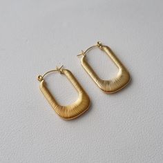 Introducing the Luna Hoops, a pair of stylish textured gold hoops featuring a chunky, rectangular U-shape for a minimalistic look. Perfect for any everyday look. -stainless steel, gold plated Paper Candle, Writing Accessories, Gold Hoops, Bag Dress, Gold Texture, Photo Jewelry, Everyday Look, Coffee Lover, Ring Earrings