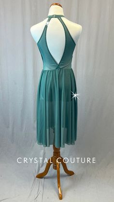 Sage Green mid length dress has high neck and key hold cutout in back. Front of bodice has alternating "stripes" of lycra and mesh. Skirt is attached. Gold floral appliqué on left chest and right hip. 2 Gross of Light Colorado Topaz 5ss, 7ss, 9ss, 12ss, 16ss, 20ss, and 30ss, and Chrysolite 9ss Rhinestones! ****Costume is photographed on Adult AS/AM mannequin measuring: Bust 35"; Waist 25"; Hips 34", Girth 57"**** Stretch Backless Midi Dress With Back Opening, Sheer Stretch Prom Dresses, Stretch Dress With Sheer Back And Backless Design, Stretch Backless Dress With Sheer Back, Stretch Dress With Closed Back For Party, Stretch Evening Dancewear Dress, Stretch Dresses For Night Out Dancewear, Stretch Dancewear Dress For Night Out, Evening Dresses With Mesh Back And Stretch