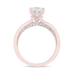 a pink gold engagement ring with diamonds on the side