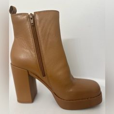 The Platform Boots From Gianni Bini Featuring Chelsea Style Side Gore Insets And A Chunky Block Heel. Size: 8.0 Color: Tan Cognac Heel 3.5” Platform 1” Side Zipper Closure Leather Rounded Closed Square Toe Chunky Block Heel Platform Boots For Fall, Chic Boots With Lug Sole And Block Heel, Fall Party Heeled Boots With Lug Sole, Chunky Leather Trendy Platform Boots, Brown Leather Platform Boots With Chunky Platform, Trendy Chunky Leather Platform Boots, Chic Heeled Boots With Lug Sole For Fall, Chic Fall Heeled Boots With Lug Sole, High Heel Faux Leather Boots With Lug Sole