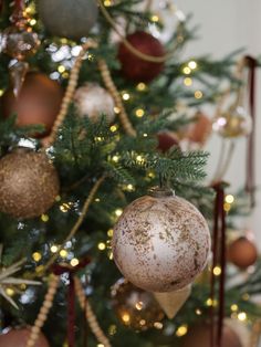 a christmas tree with ornaments hanging from it