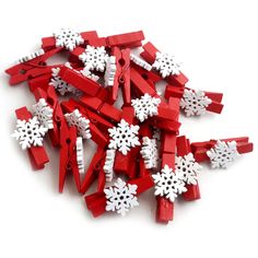 a pile of red and white snowflakes sitting on top of each other