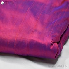 Iridescent Red Blue Pure Dupioni Silk Fabric by Yard Red Wedding  Raw Silk Dupion Crafting Sewing Dress Bridesmaid Prom Dresses Indian ➤Color: Iridescent Red and Blue  ➤Quality: The fabric is 100% dupioni silk of the highest grade. (100gsm) ➤Width: 44 inches  ➤Listing for 1 Yard of fabric. ➤Code: sf178 This iridescent silk dupioni fabric has a brilliant sheen and cross threads of Red and Blue. The Dual tone of both colors is evident under different lighting and angles, though Red is very visible in the fabric with strong undertone sheen of Blue is always reflected. The Blue warp provides superb depth to the color of this silk, producing a gorgeous jewel tone look. As all silk fabrics color and reflection change under different light conditions. Tends to be milder in color under natural lig Wedding Bridesmaid Dresses Indian, Bridesmaid Dresses Indian, Dupioni Silk Fabric, Sewing Upholstery, Indian Colours, Sewing Wedding Dress, Sewing Dress, Silk Dupioni, Raw Silk Fabric