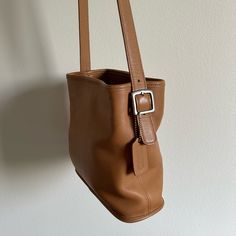 Vintage Coach Leather Bucket Bag Purse. Very Spacious & Well Loved Vintage Condition. Small Stains/Scratches/Imperfections Are Pictured. Leather Is Very Soft And High Quality. 2 Zipper Compartments And Magnetic Closure. Classic Coach Tag & Coach Branded Hardware. The Strap Has Adjustable Buckles. Roughly 10” L X 4” W X 9” H Classic Coach Bucket Bag For Everyday Use, Classic Bucket Shape Shoulder Bag, Rectangular Camel Bucket Bag, Classic Coach Bucket Bag For Daily Use, Vintage Everyday Bucket Bag, Coach Bucket Bag For Everyday, Chic Brown Bucket Bag With Snap Closure, Everyday Coach Bucket Bag, Coach Brown Leather Bucket Bag