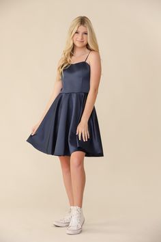 Blonde girl in a Un Deux Trois fit and flare navy satin dress. Teenage Dress Outfits, Grade 8 Grad Dresses Navy Blue, Banquet Dresses For Teens Long, Dance Dresses For Middle School, Teen Semi Formal Dresses, Navy Blue Dresses Short, Cute Prom Dresses For Teens, Promotion Dresses 8th Grade Graduation, Culmination Dresses